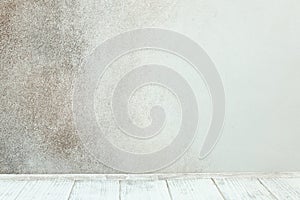 Empty white wooden table in front of stone wall