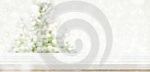 Empty white wooden table top with abstract muted blur christmas