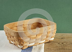 empty wicker basket on an old wooden table