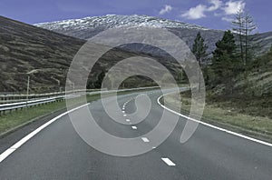 Empty winding road in the Scottish mountains