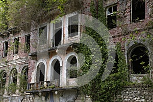 The windows of an old abandoned Soviet-built building. Tkuarchal, Abkhazia