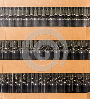 Empty wine bottles at shop or winery factory