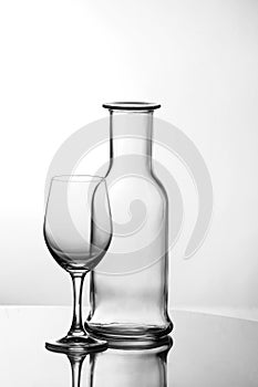 Empty wine glass with bottle