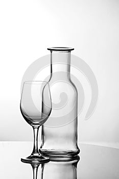 Empty wine glass with bottle photo