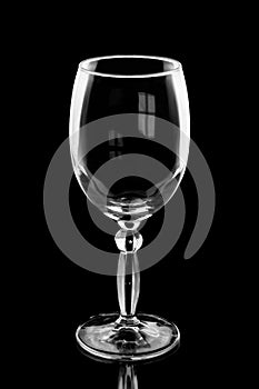 Empty wine glass isolated on black