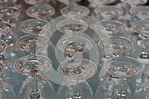 Empty wine glass stacked-up on one another in pattern photo