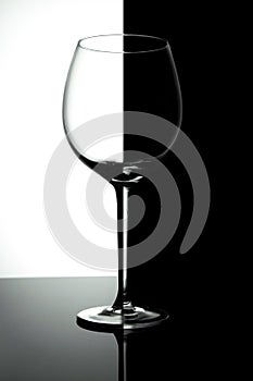 Empty wine glasses isolated on black and white  background.