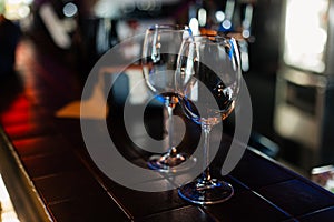 Empty wine glasses in row on bar or restaurant