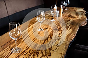 Empty wine glasses on slab table in restaurant
