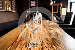 Empty wine glasses on slab table in restaurant