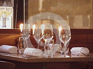 Empty wine glassess by a restaurant window