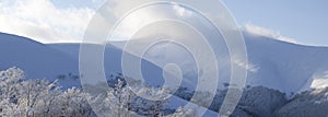 Empty winter background - landscape panorama of blue top mountains range