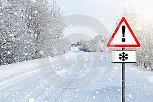 Empty winter road with sign