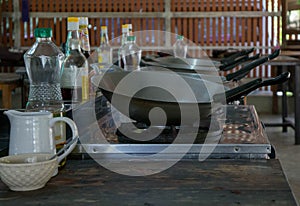 Empty woks in a cooking class