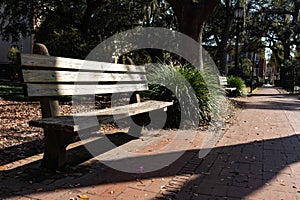 Empty Wood Bench at Monterey Square in the Historic District of Savannah Georgia