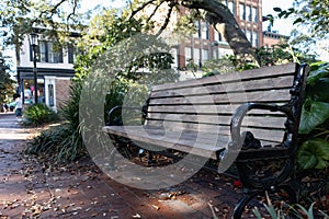 Empty Wood Bench at Wright Square in the Historic District of Savannah Georgia