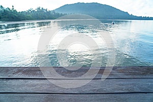 Empty wood desk and summer blue sea background .Blank space for text and images