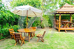 empty wood outdoor patio table and chair in home garden