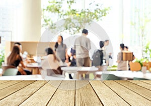 Empty wood perspective,table top, over blur group of people team