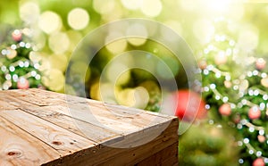Empty wood plank food stand with blur Christmas tree bokeh light