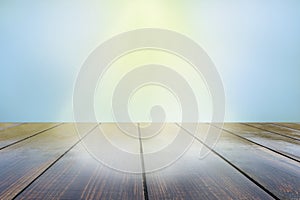 Empty wood plank table top with sunny rays. sunrays falling on vintage boards