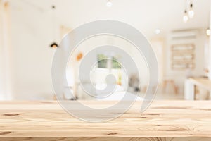 Empty wood table with blur coffee shop background clean bright light foreground Mock up for montage products display