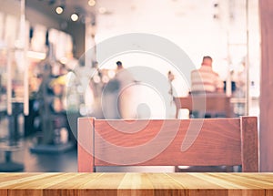 Empty wood table with blur coffee shop background,Mock up Template for display of product