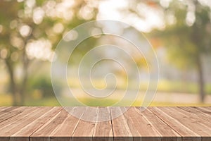 Empty wood table on blurred background copy space for montage your product or design,Blank brown board with abstract blurred