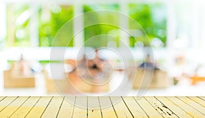 Empty wood table and blurred living room background.