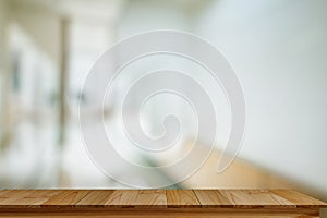 Empty Wood table with blurred office background.