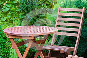 Empty wood table and chair on the terrace at summer day