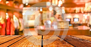 Empty wood table and Coffee shop blur background with bokeh image