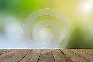 Empty wood table with sunlight bokeh background