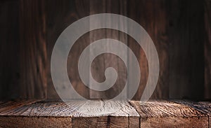 Empty wood table surface with defocused wooden wall background