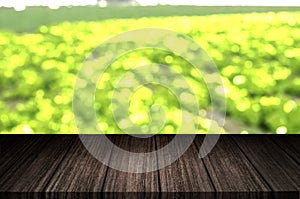 Empty wood table top on blur abstract background. For montage product display layout