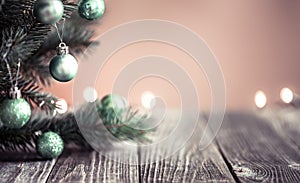 Empty wood table top and blur background, selective focus with lights and Christmas tree. For montage product display