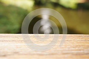 Empty wood table top and blur glass window wall building banner mock up abstract background - can used for display or