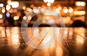 Empty wood table top bar on blur cafe restaurant in dark background