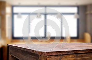 Empty of wood table top on blur of window glass in the morning b