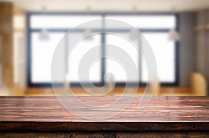 Empty of wood table top on blur of window glass in the morning b