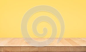 Empty of wood table top on yellow pastel color background.For montage product display or design key visual