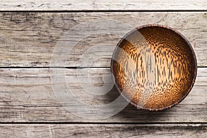 Empty Wooden Bamboo Bowl isolated on wood Background with Real S