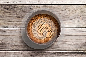 Empty Wooden Bamboo Bowl isolated on wood Background with Real S