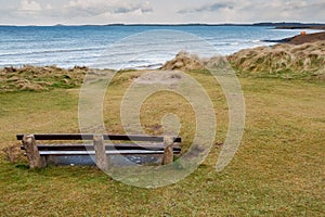 Empty wooden bench by the Atlantic ocean, with beautiful relaxing view. Rosses point, county Sligo, Ireland, Nobody, Blud cloudy