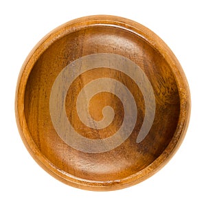 Empty wooden bowl over white