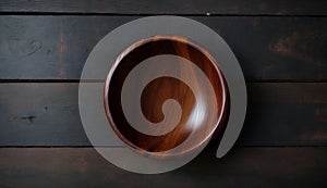 Empty Wooden Bowl on Rustic Dark Table Top View, Copy Space