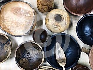 Empty wooden bowl on white linen fabric. Top view of wooden bowl on weathered background. Close up top view of wooden empty bowl