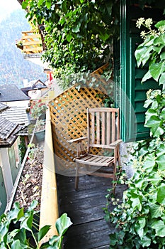 Empty wooden chair on a balcony in Hallstatt