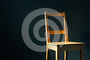 Empty wooden chair in dark room