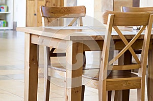 Empty wooden chairs and tables in a cafe